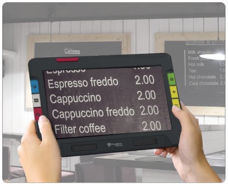 Photo of someone using the RUBY 10 to read a menu hanging on the wall of a coffee shop